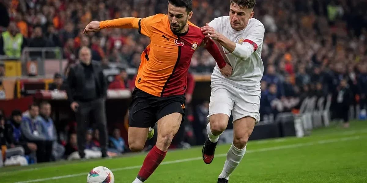 Player from Galatasaray evading opponent during match