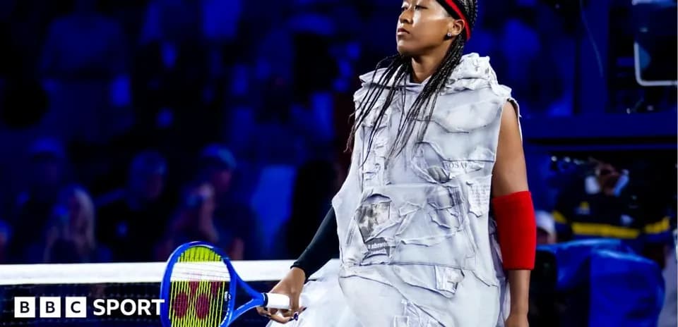 Naomi Osaka entering the court with a racket