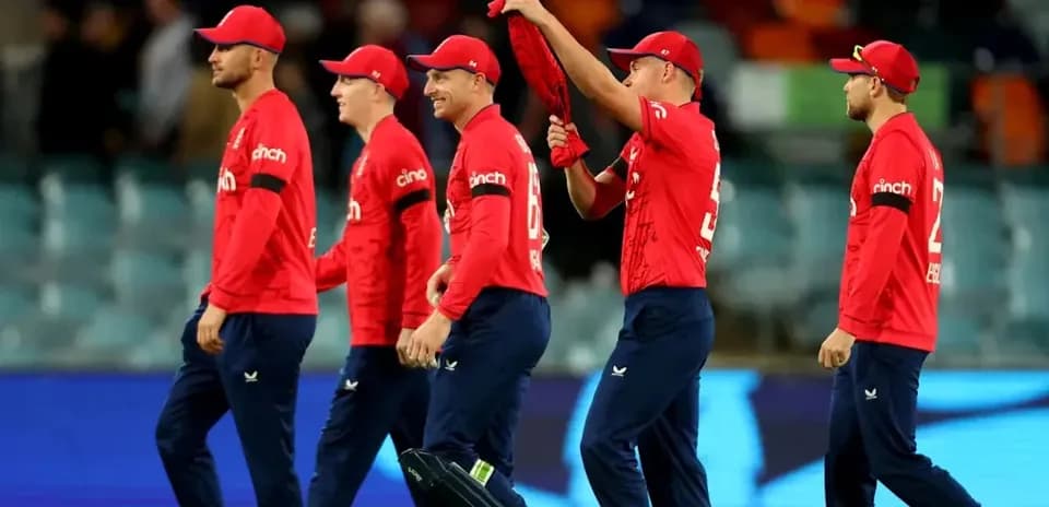 England cricket team walking off the field together