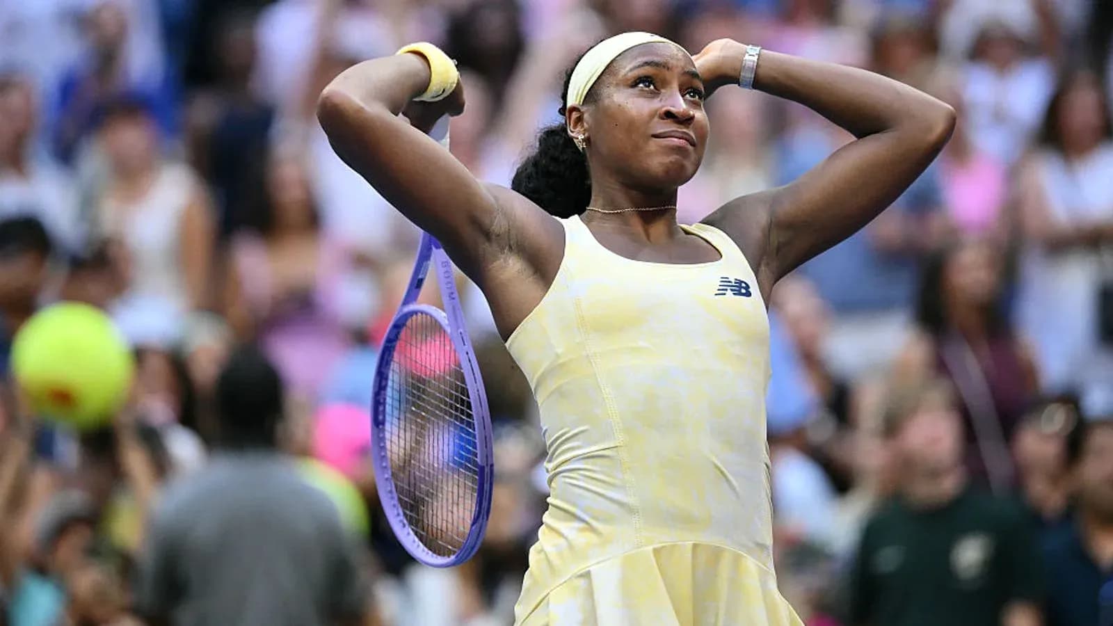 Coco Gauff celebrating with her racket at match