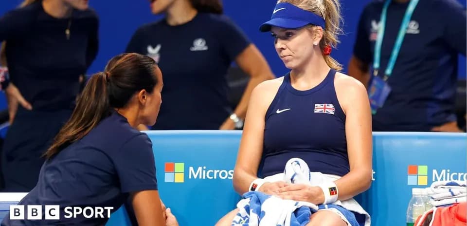 Player seated during a break with coach