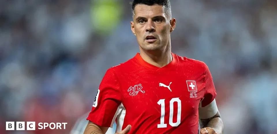 Football player wearing red jersey during match