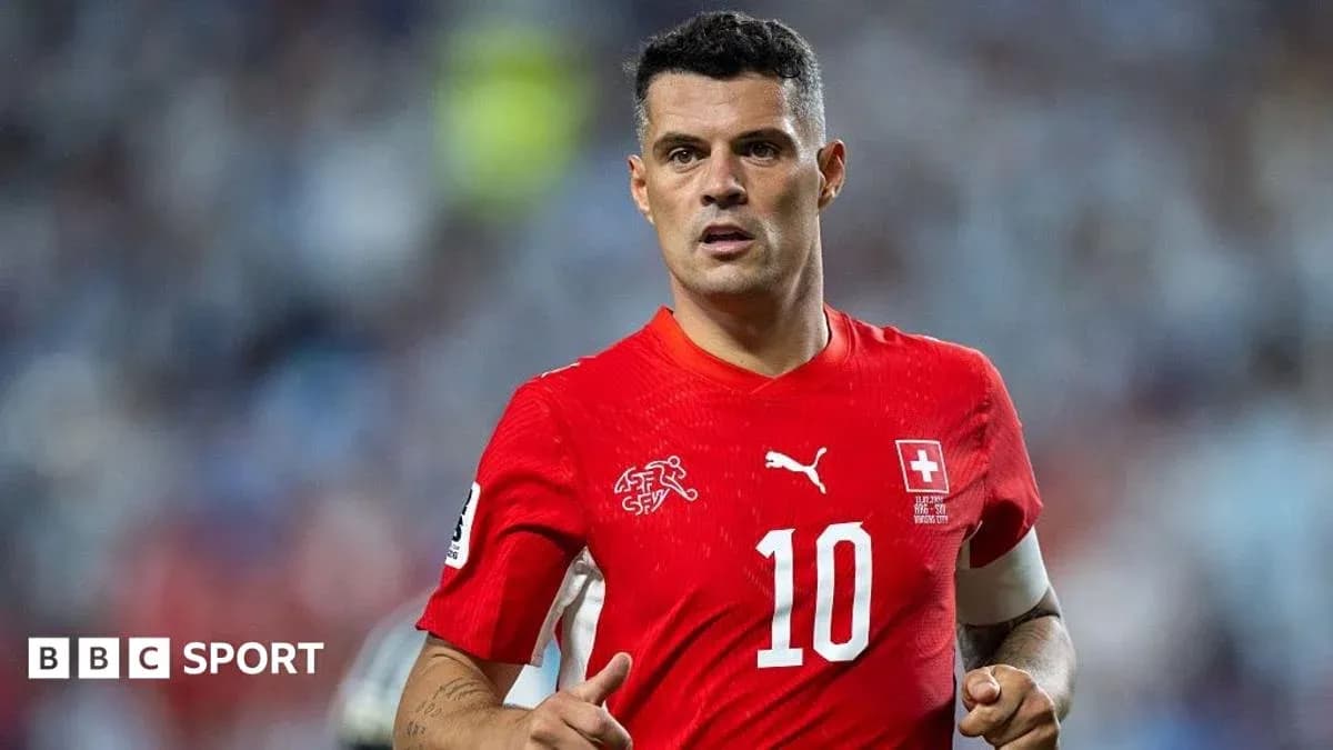 Football player wearing red jersey during match
