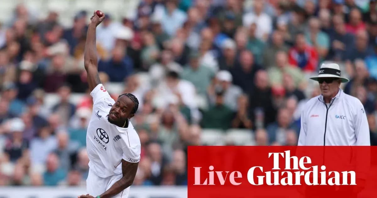 Bowler delivering a ball with spectators in background