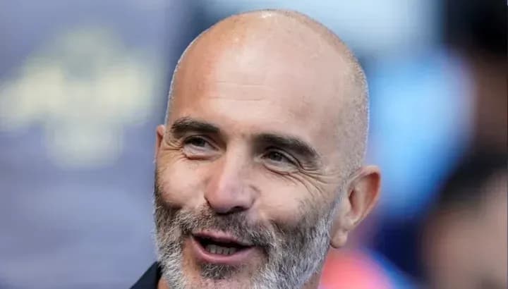 Man smiling during a sports event