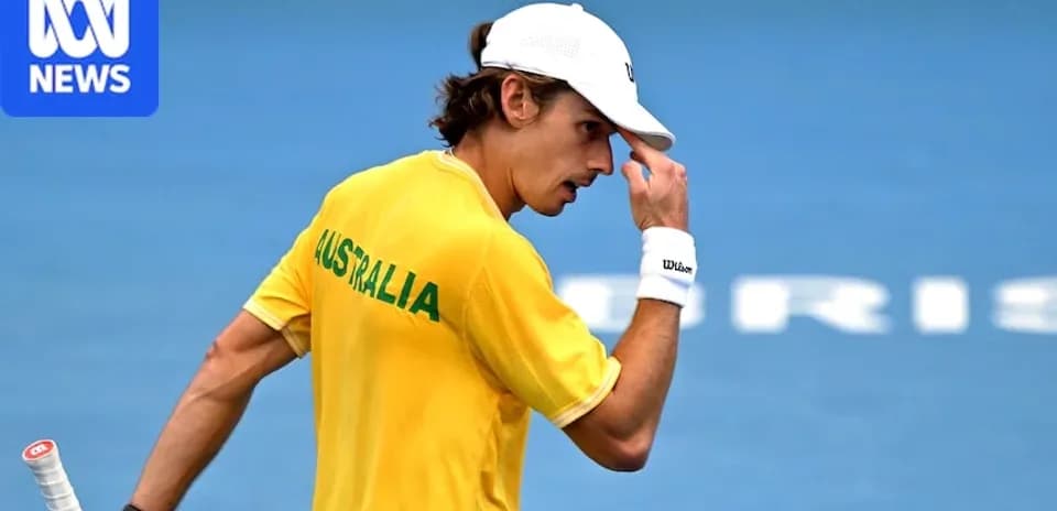 Tennis player in Australia jersey celebrating on court