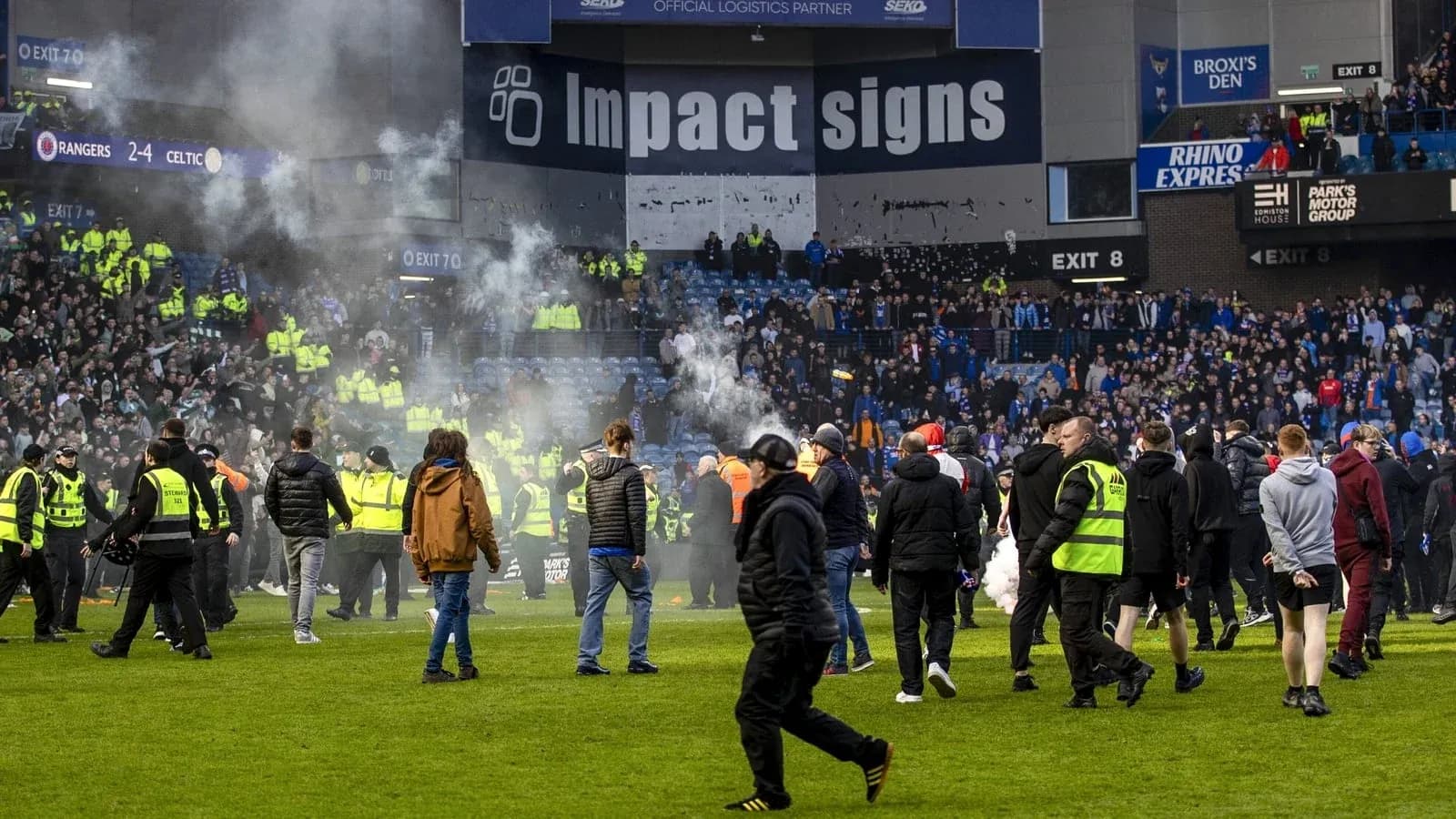 Fans on the pitch during a heated match incident