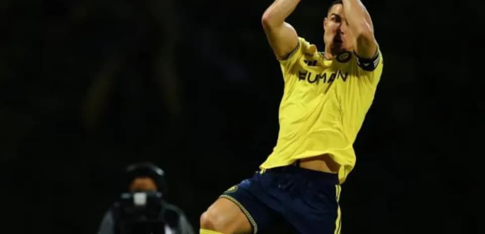 Player celebrating after scoring a goal in match