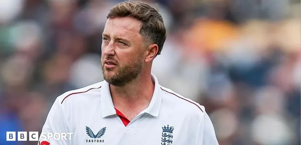 Cricketer in England kit on field during match