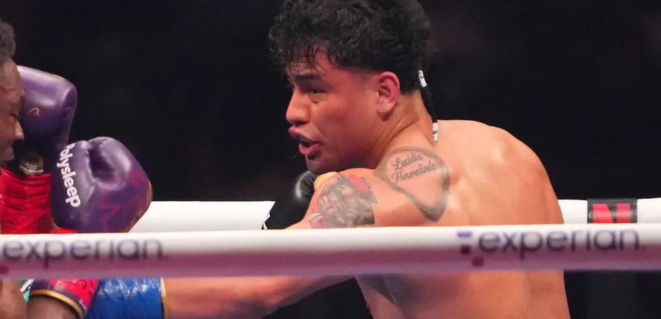 Boxer delivering a punch in the ring