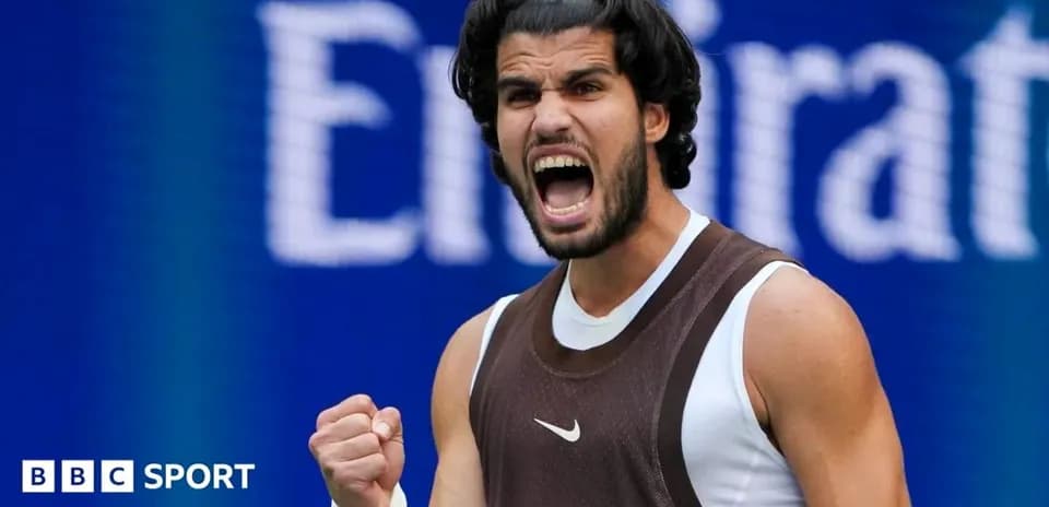 Tennis player celebrating victory with raised fist