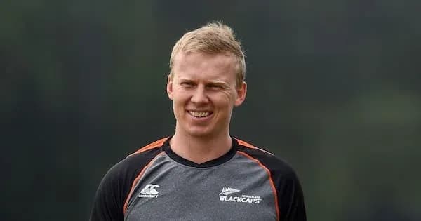 Cricketer in Blackcaps training gear smiling outdoors