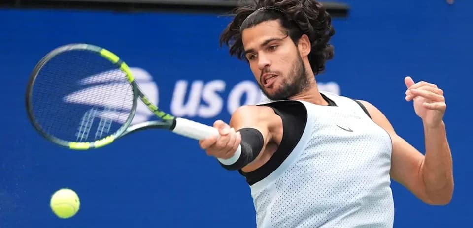 Player hitting a forehand during a tennis match