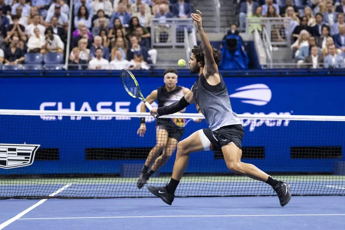 Player reaching for a tennis ball during match