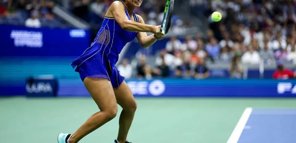 Player hitting a forehand during a tennis match