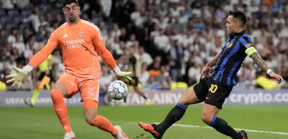 Goalkeeper saves shot from player during match