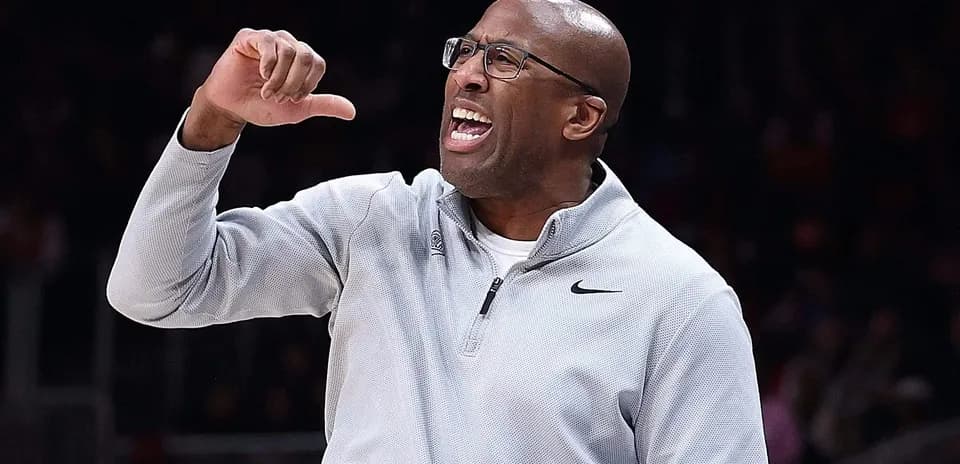 Coach gesturing and shouting during a game