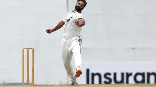 Bowler delivering ball during cricket match