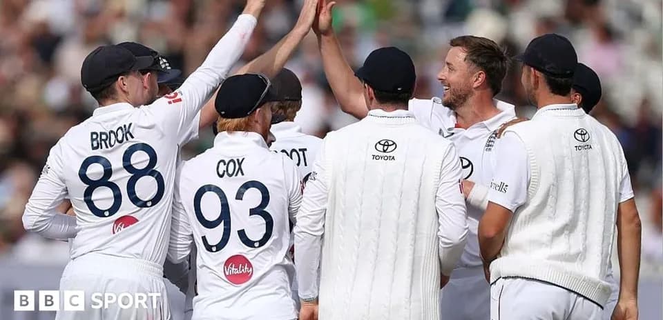Cricket team celebrating a wicket on the field
