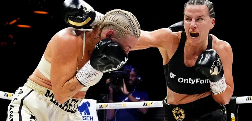 Two female boxers competing in a match