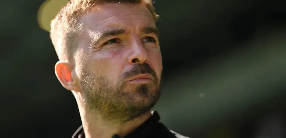 Coach looking thoughtfully during a match
