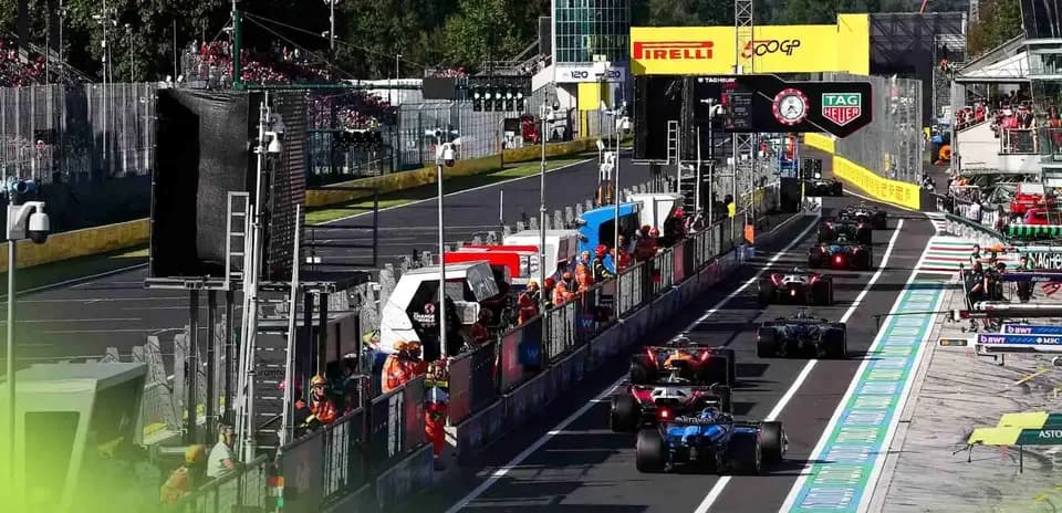 Formula 1 cars in the pit lane during race