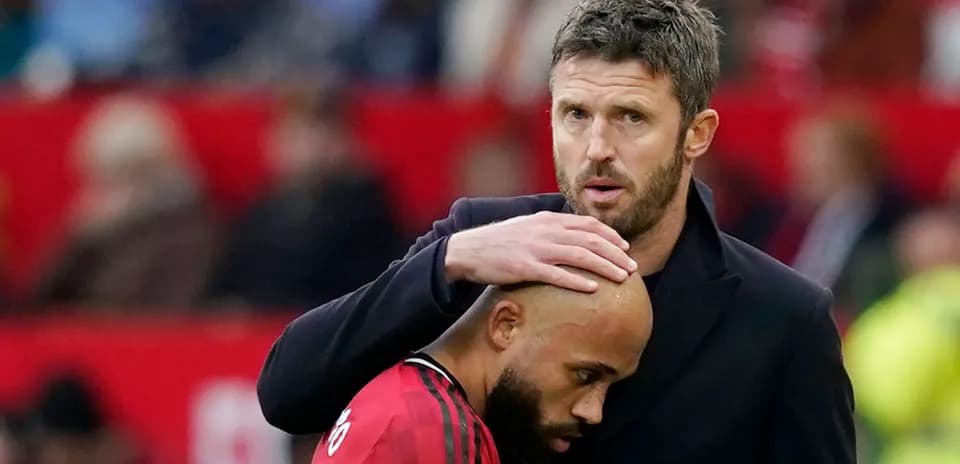 Coach comforting player on the sideline
