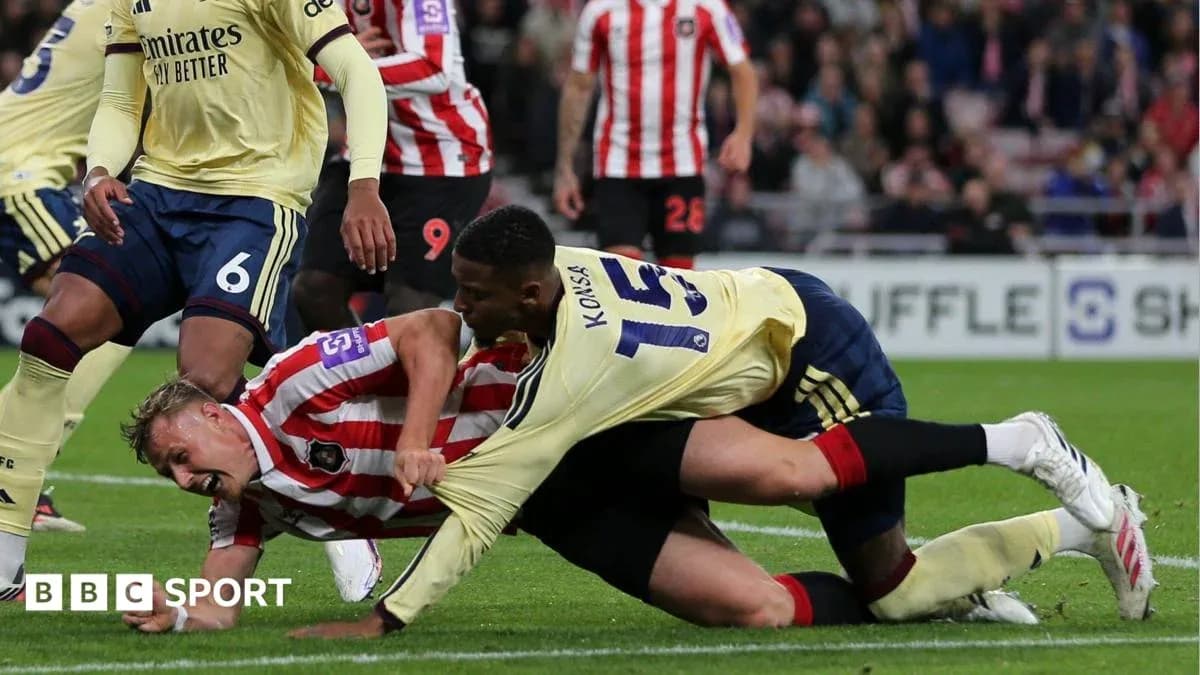 Players battling for the ball on the ground