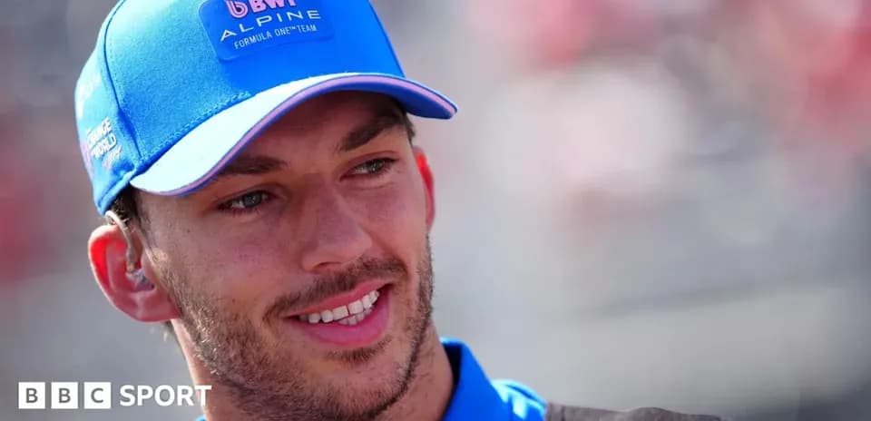 Driver in Alpine cap smiling before the race