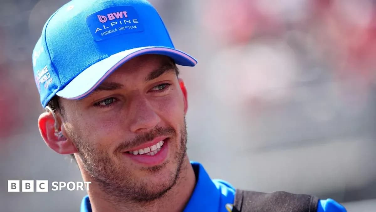 Driver in Alpine cap smiling before the race