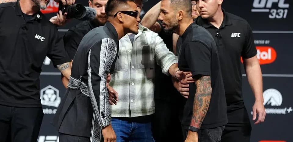 Two fighters face off during UFC 331 weigh-in