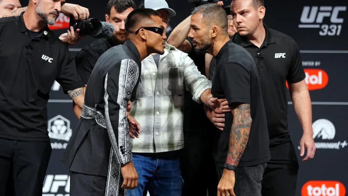 Two fighters face off during UFC 331 weigh-in