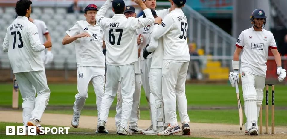 Players celebrating a wicket during a cricket match