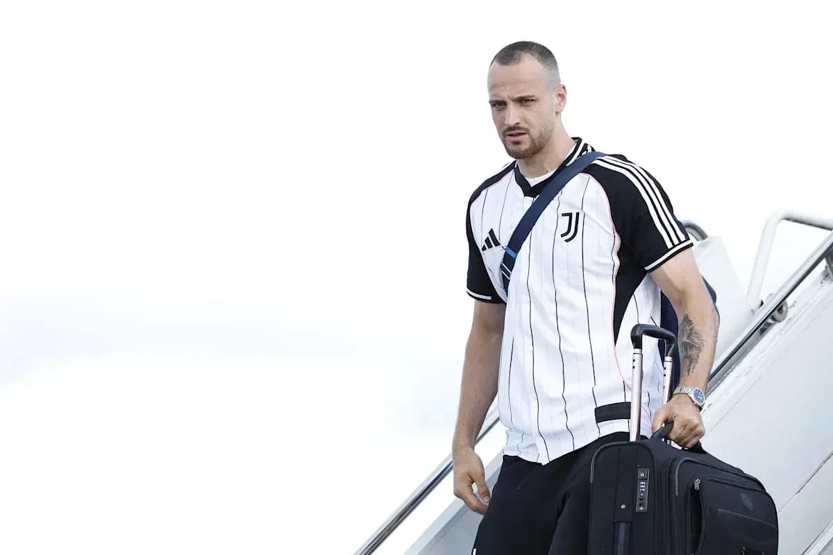 Player arriving at airport with suitcase in hand