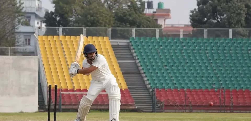 Batsman preparing to hit ball during cricket practice