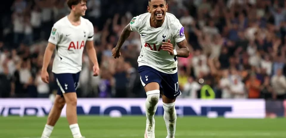 Tottenham players celebrating a goal on the field