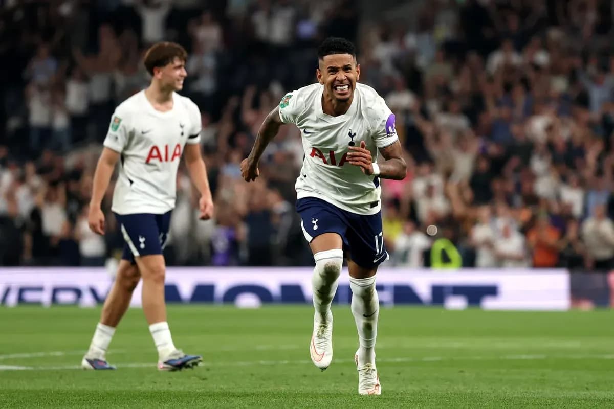 Tottenham players celebrating a goal on the field