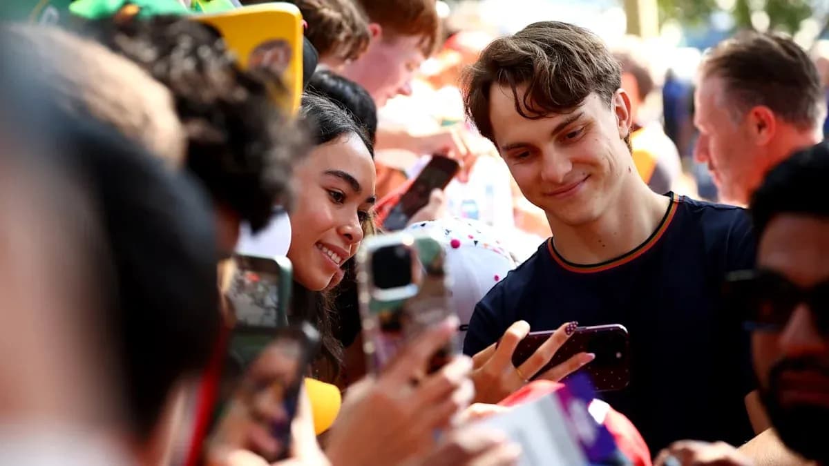 Fans taking selfies with a celebrity at event