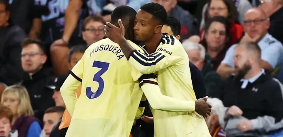 Players embracing during a football match celebration