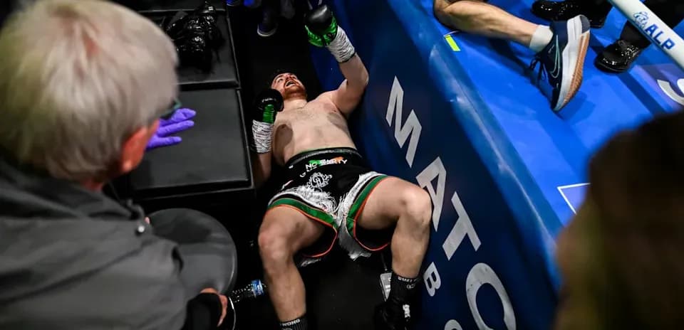 Boxer lying on the floor after the match