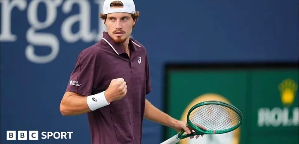 Tennis player celebrating during a match at court