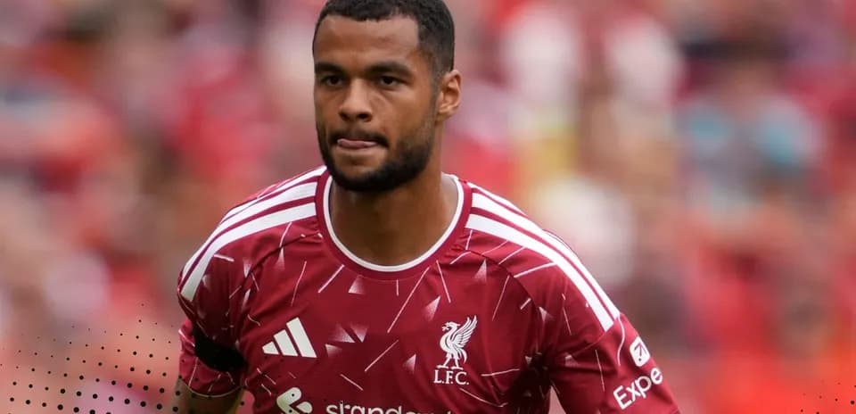 Player in Liverpool kit walking on the pitch