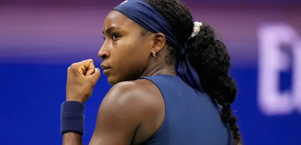 Tennis player celebrating a point during match