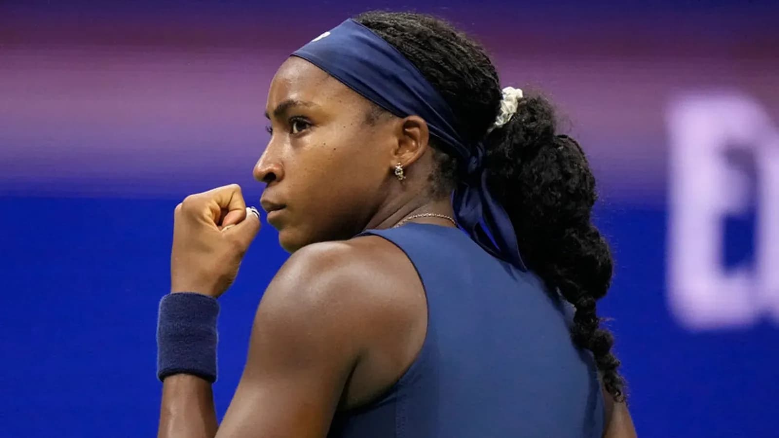 Tennis player celebrating a point during match