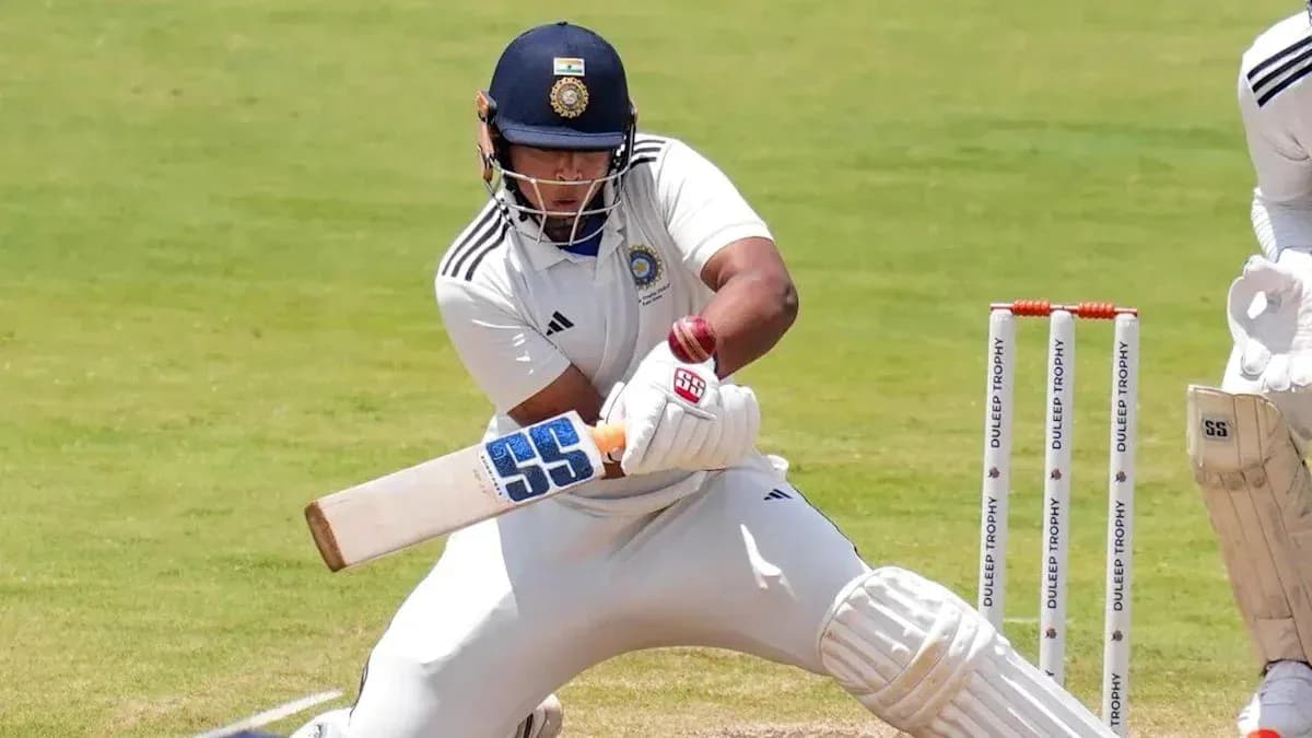 Batsman playing a shot during cricket match