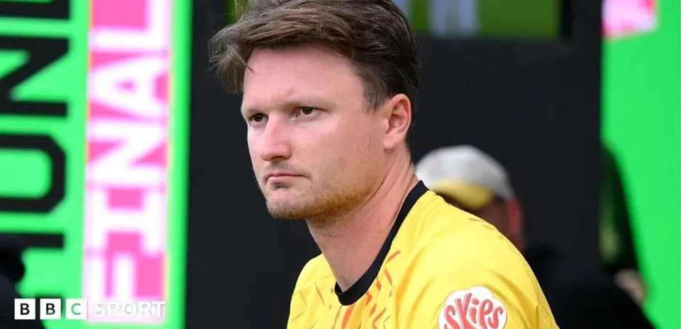 Goalkeeper sitting on bench during match preparation