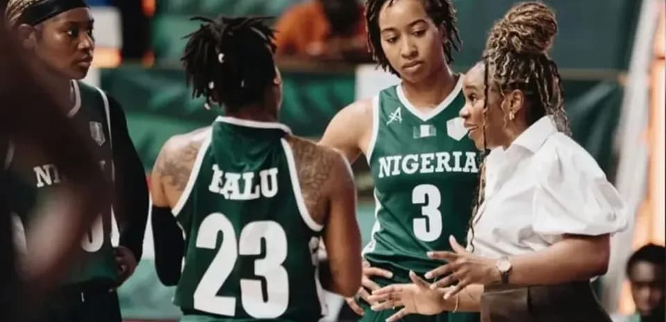 Nigeria women's basketball team in huddle during timeout