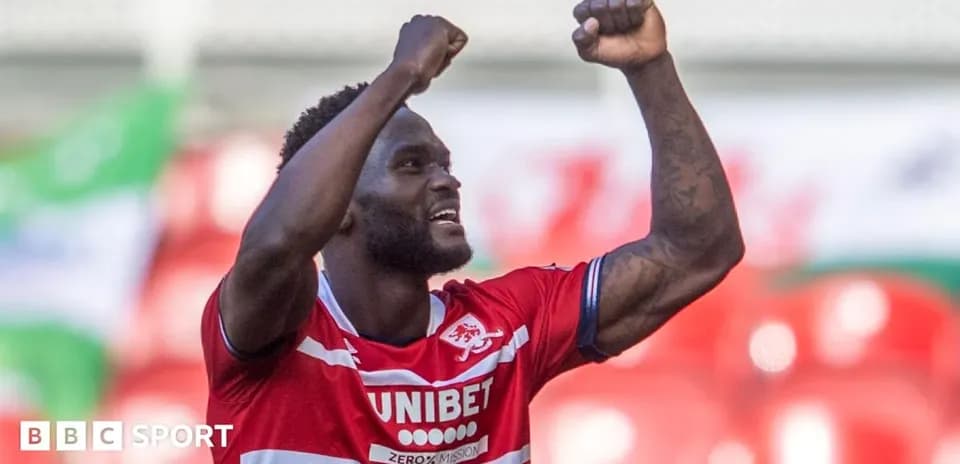 Player celebrating with raised fists after scoring