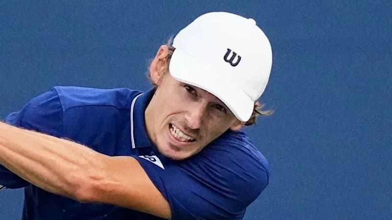 Tennis player striking a forehand shot
