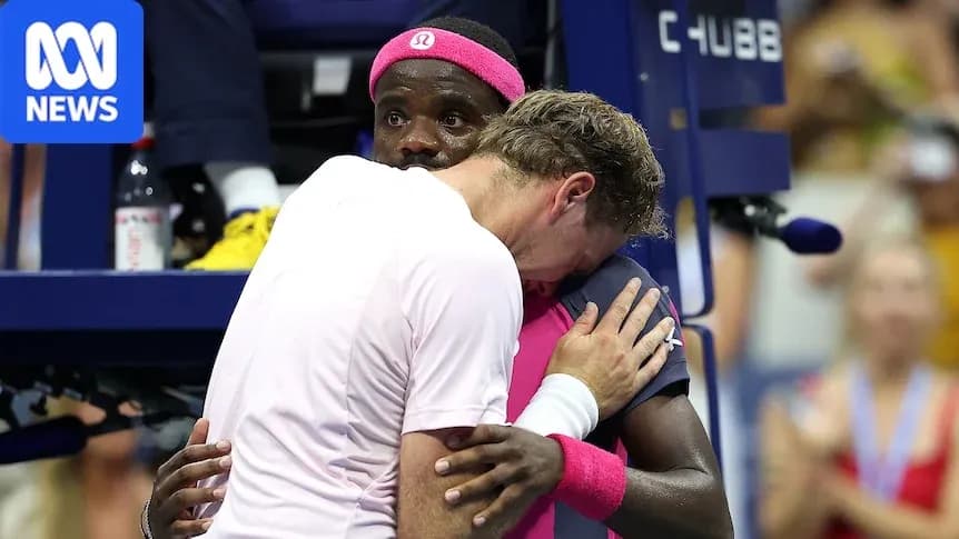 Players embracing during a tennis match celebration